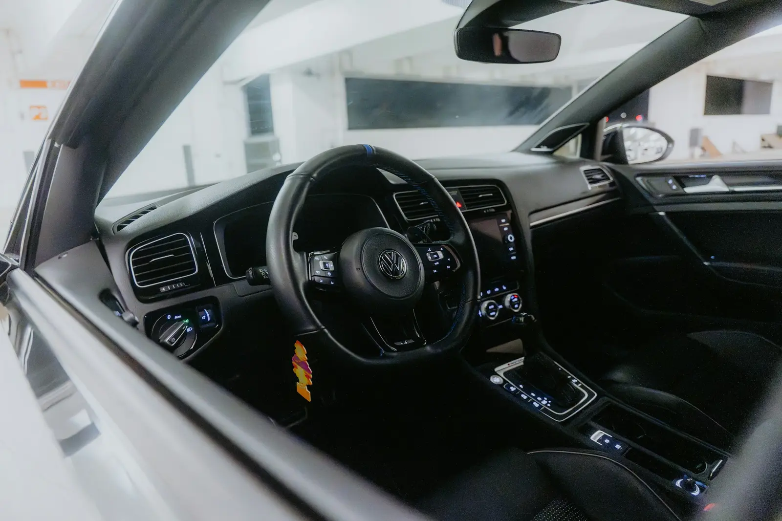 Car dashboard with air-conditioning vents and climate controls